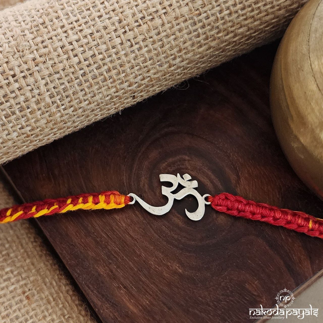 Curly OM Moli Rakhi (R1611)